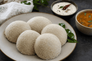 Soft and fluffy foxtail millet idli served with coconut chutney and sambar