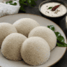 Soft and fluffy foxtail millet idli served with coconut chutney and sambar